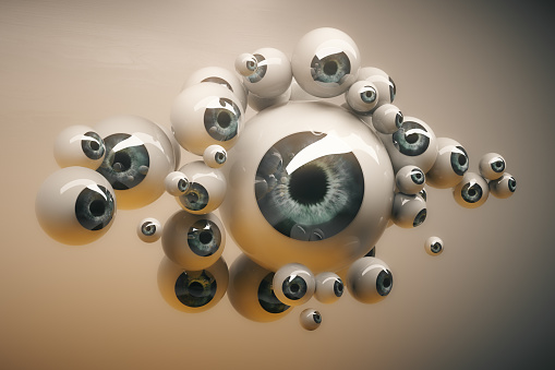 Abstract collection of different sized grey eyeballs on light background. 3D Rendering