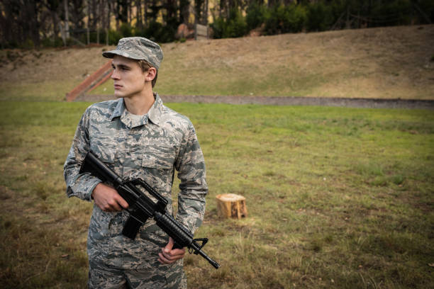 istock Military soldier guarding with a rifle 657659360