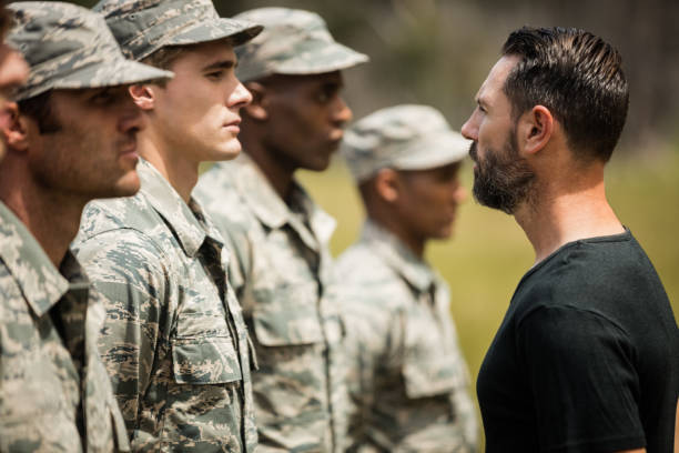 istock Trainer giving training to military soldier 657660094