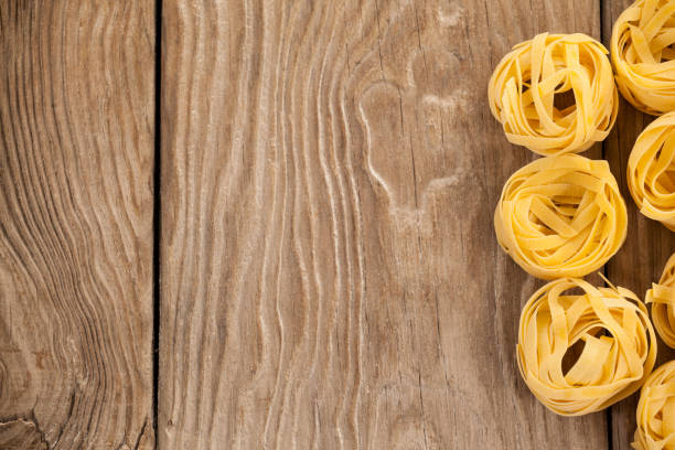 Fettuccine pasta arranged in a row