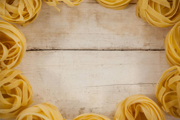 Fettuccine pasta on wooden table