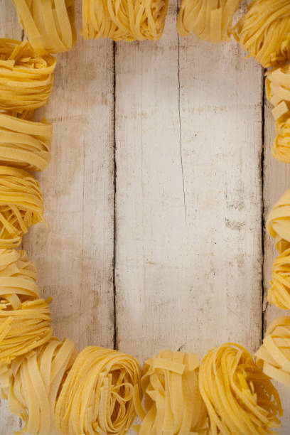 Fettuccine pasta on wooden table