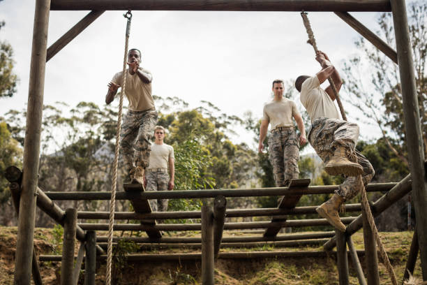 istock Military soldiers training rope climbing 657670054