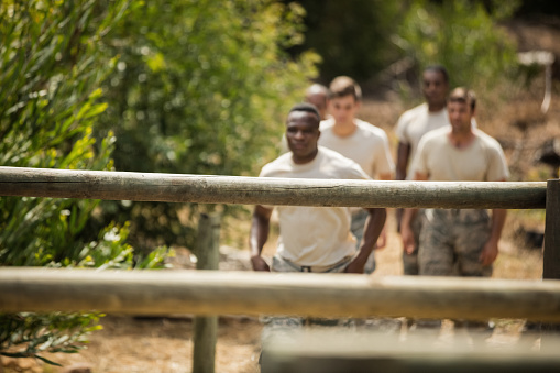 Military soldiers training on fitness trail at boot camp