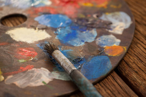 istock Palette with multiple colors and paint brush 657672668