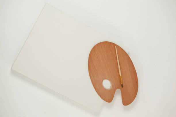 istock Wooden palette and paint brush 657672996