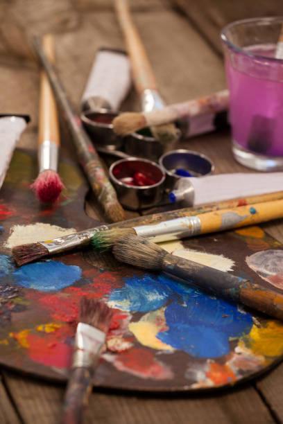 istock Palette with multiple colors, watercolor and paint brushes 657678530