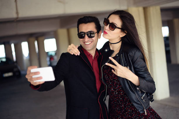 istock Young happy couple taking a selfie with smartphone 657679330