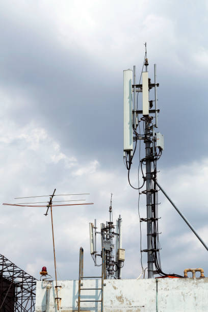 istock Mobile phone transmission pole on top of building 657681426