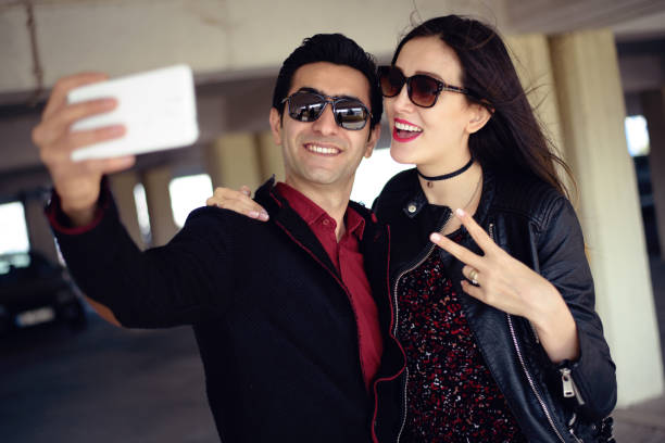 istock Young happy couple taking a selfie with smartphone 657681458
