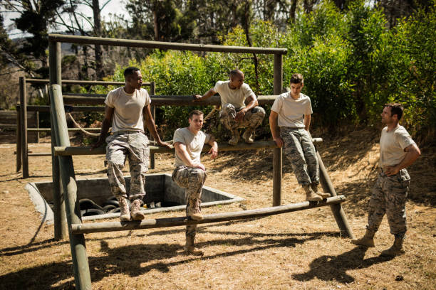 istock Soldiers sitting on the obstacle course 657681496