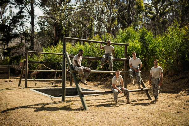 istock Soldiers sitting on the obstacle course in bootcamp 657681520