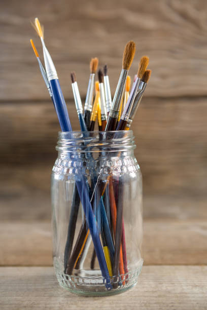 istock Various paintbrush in a glass jar 657685204