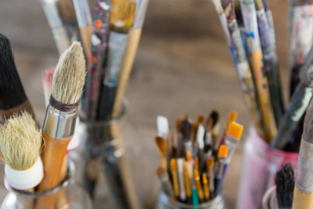 istock Various paintbrush in glass jar 657685210