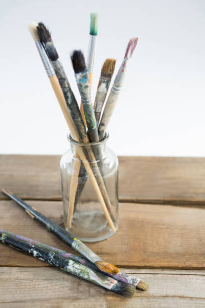 istock Various paintbrush in glass jar 657685244