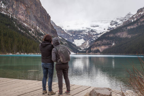 istock Two Girls Looking at Lake Louise 657688546