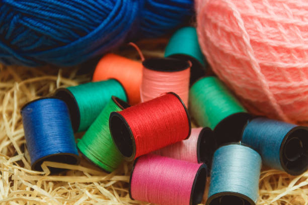 istock Hanks of bright yarn for knitting on a bright background with copyspace 657688692
