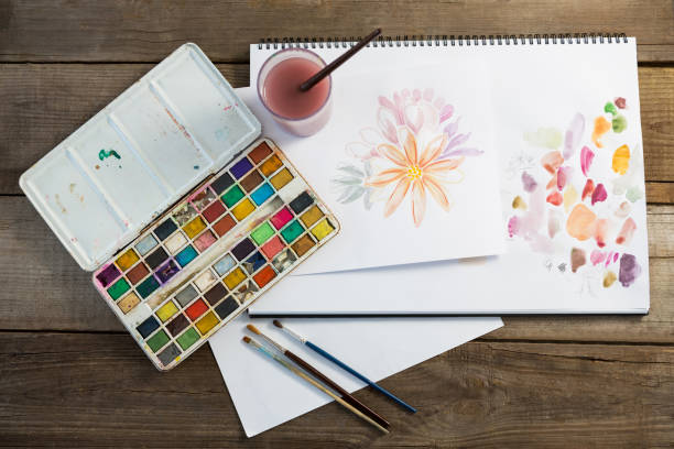 istock Drawing equipments on wooden surface 657688824