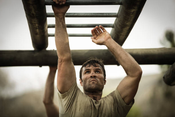 Soldier climbing monkey bars Soldier climbing monkey bars in boot camp military lifestyle stock pictures, royalty-free photos & images