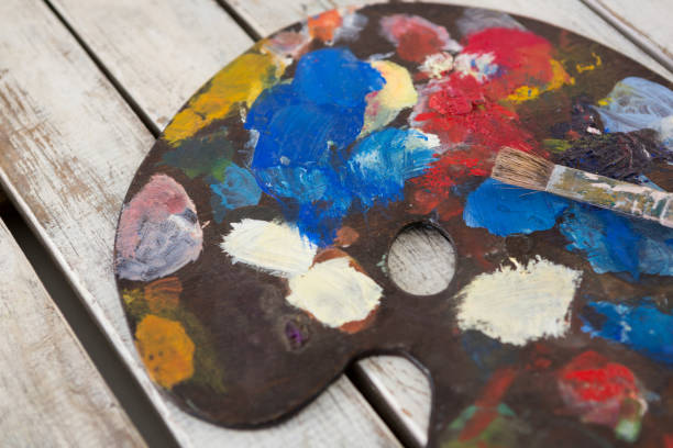 istock Watercolor paints and paint brushes on palette 657689220