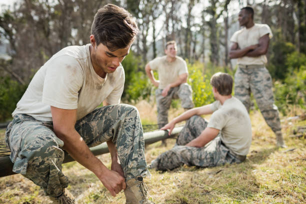 istock Soldier tying his shoe laces 657691604