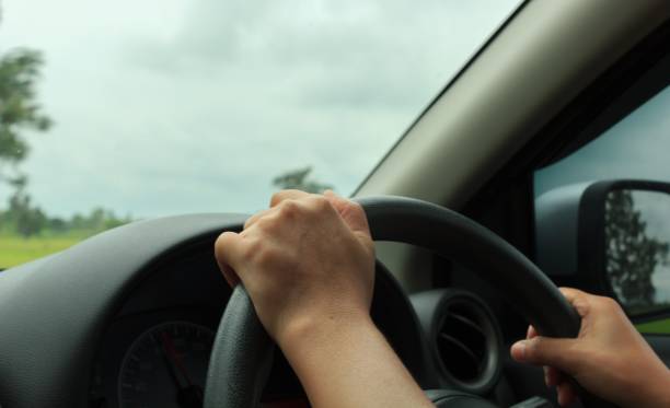 istock hand is holding the steering wheel 657695870