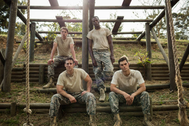 istock Soldiers sitting on the obstacle course in boot camp 657702116
