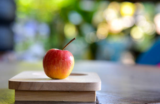 istock Fresh sweet red apple on wood tray. 657702410