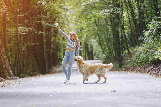 istock couple walking outdoors with her dog 657704990