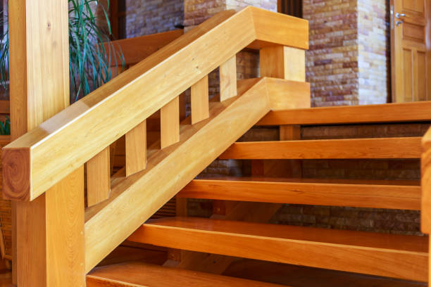 istock Modern style staircase with wooden steps and handrail. 657705038