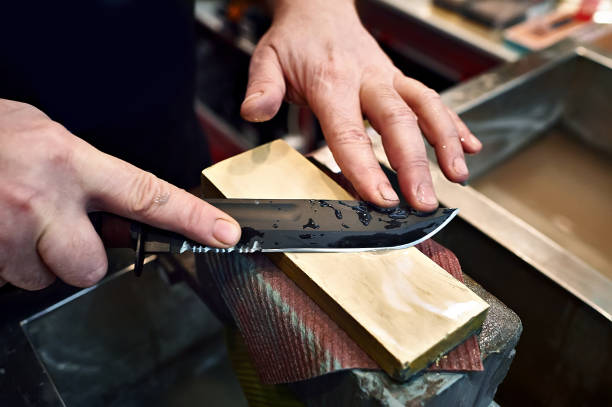 Knife sharpening stock photo