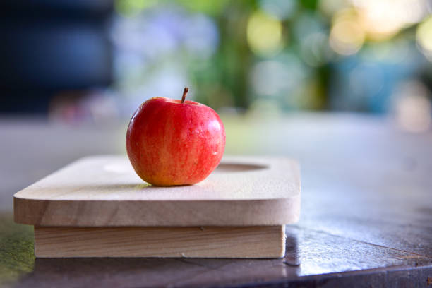 istock Fresh sweet red apple on wood tray. 657708020