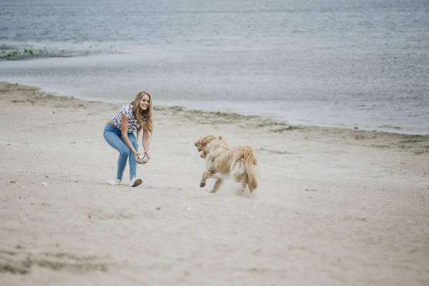 istock couple walking outdoors with her dog 657710698
