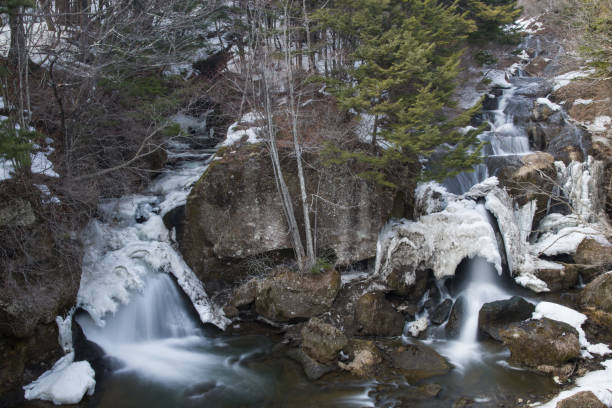 Ryuzu Waterfall with the remaining snow, Okunikko, Nikko, Japan stock photo
