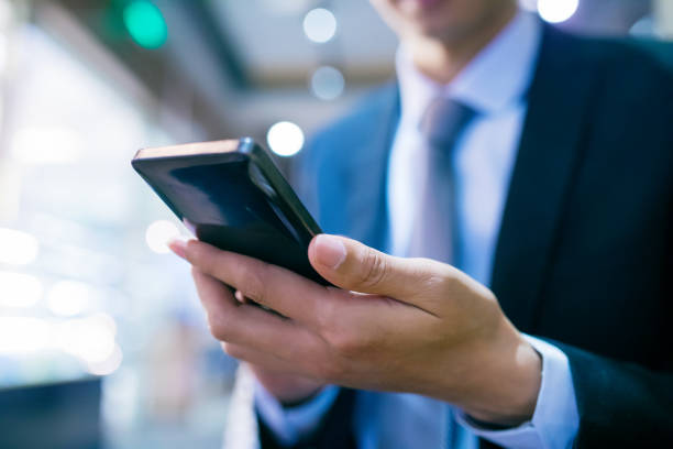 istock businessman holding mobile phone 657723904