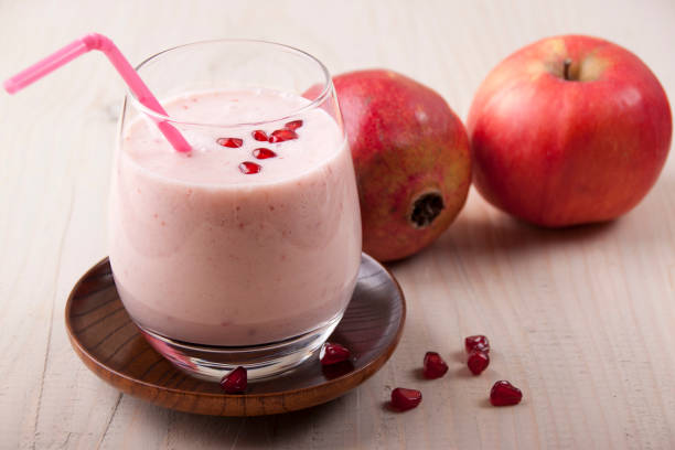 istock Smoothies with apple and pomegranate with yoghurt on a wooden table 657724142