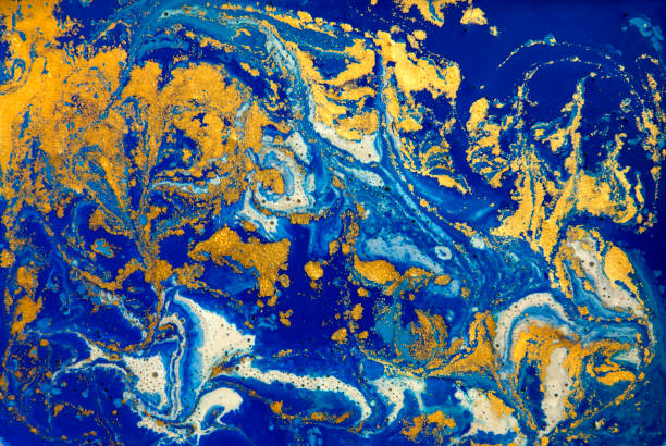 istock Blue and golden liquid texture, watercolor hand drawn marbling illustration, abstract background 657724260