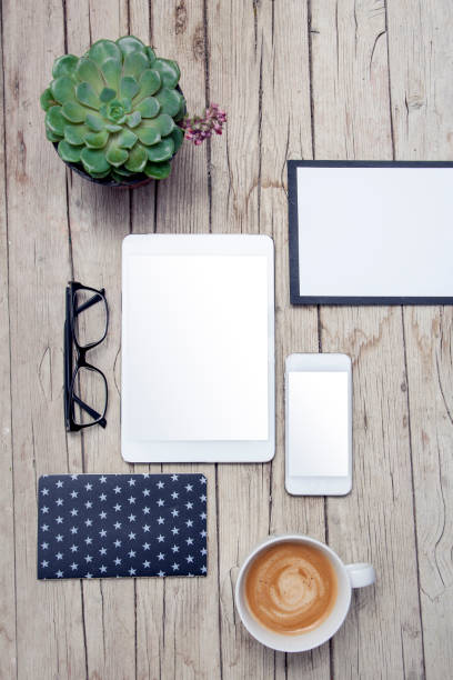 modern office desk with mock up tablet and handy