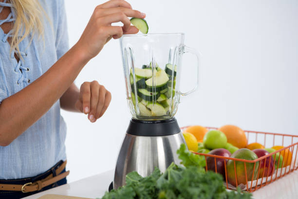 istock Woman preparing vegetable smoothie 657733702
