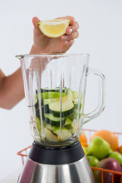 istock Woman preparing vegetable smoothie 657733780