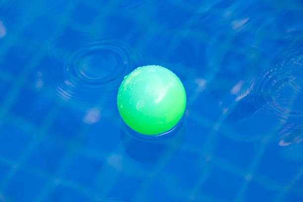 Green plastic ball in pool , pool villa house.