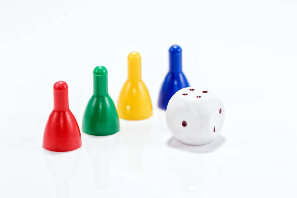 istock Colorful game pieces from a children's game standing in line 657733870
