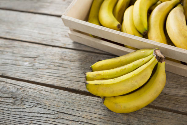istock Bananas in wooden crate 657733902