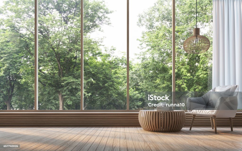 Modern living room with nature view 3d rendering Image Modern living room with nature view 3d rendering Image. There are decorate room with wood. There are large window overlooking the surrounding nature and forest Window Stock Photo