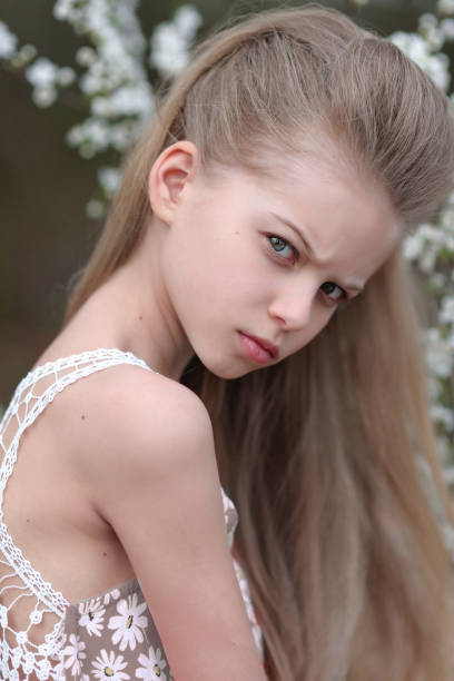 istock portrait of little girl outdoors in spring; 657743708