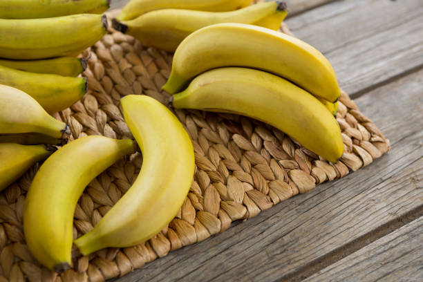 istock Bananas kept on placemat on wooden table 657743718