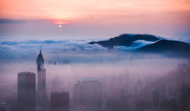 istock Clouds rolling over Hong Kong Victoria Harbor at misty season 657743980