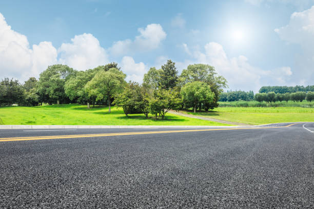 istock Asphalt road and green trees in the blue sky 657746696