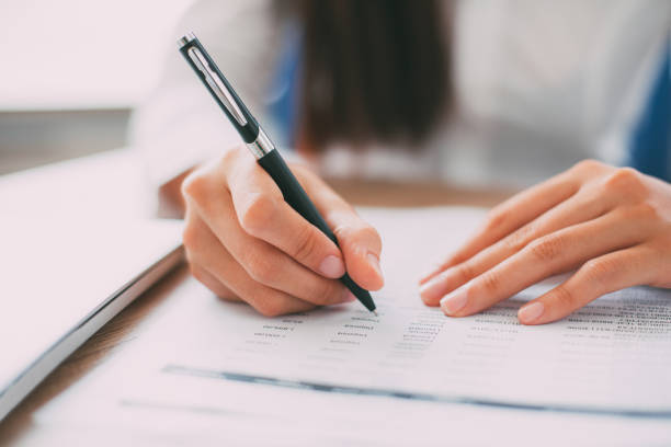 istock Closeup of Business Person Working with Document 657747186