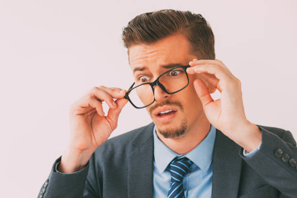 istock Desperate Young Business Man Taking Glasses Off 657747320